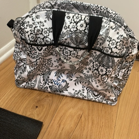 Oilcloth Alley travel bag. Has multiple zippers and pockets. - Picture 2 of 2